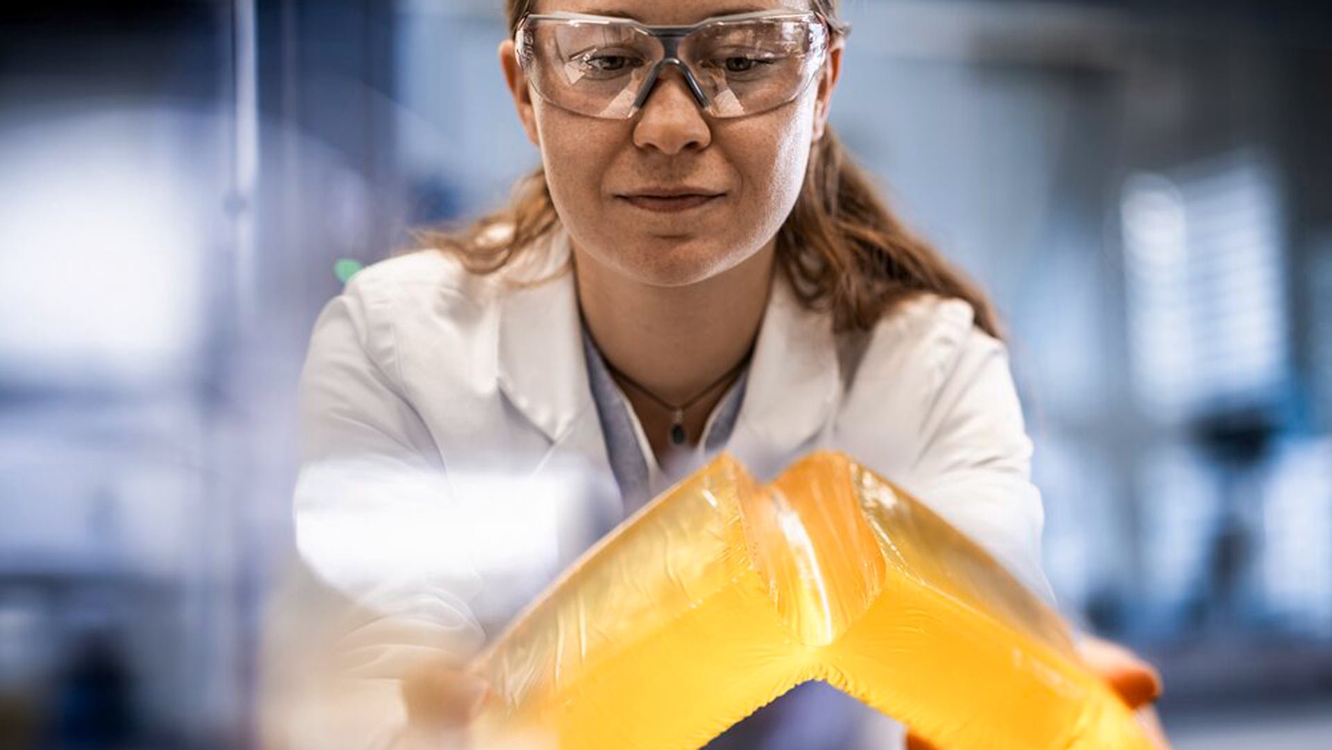 Employee-holding-hotmelt-block