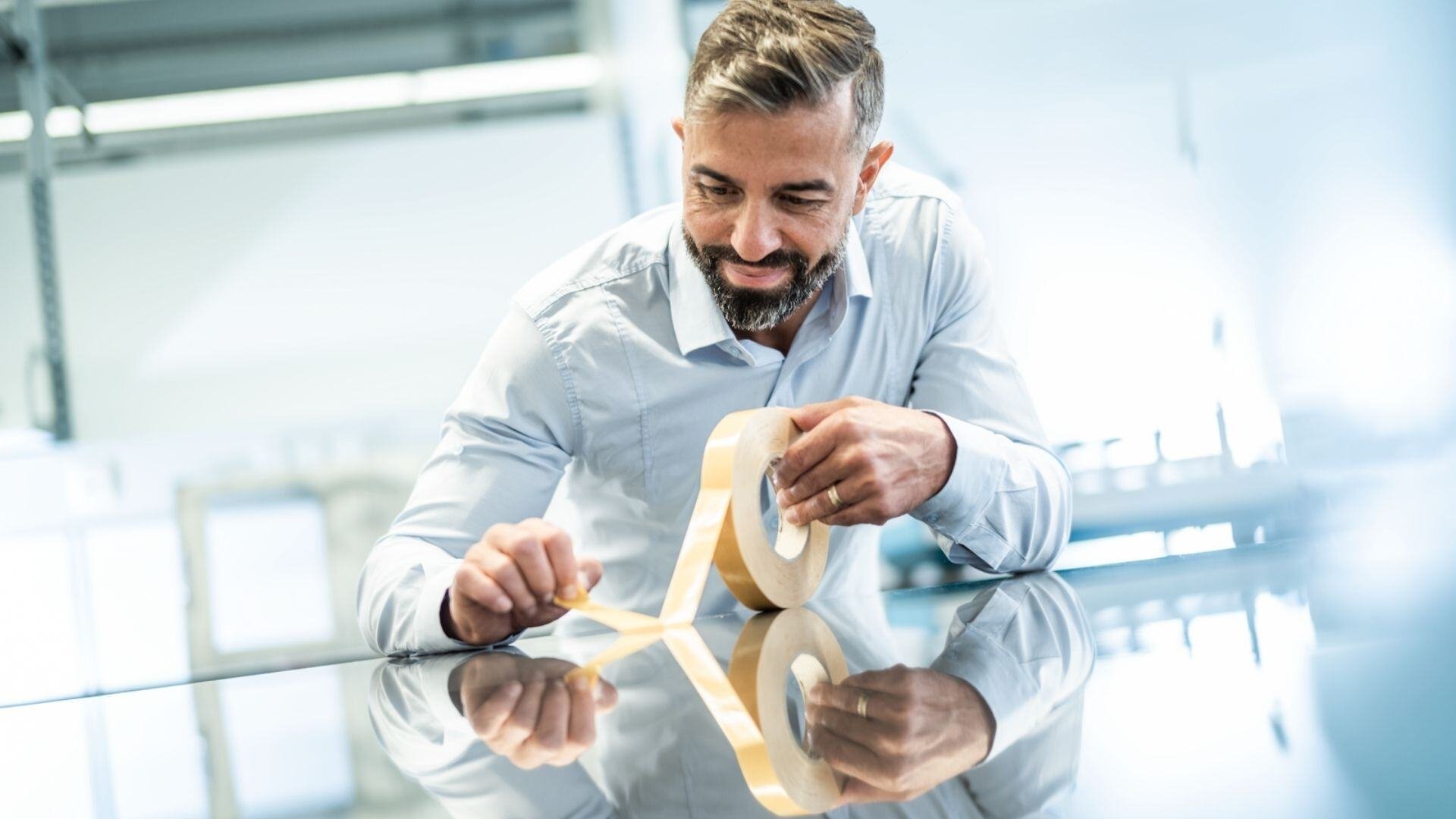 Lohmann-research-development-lab-expert-with-tape