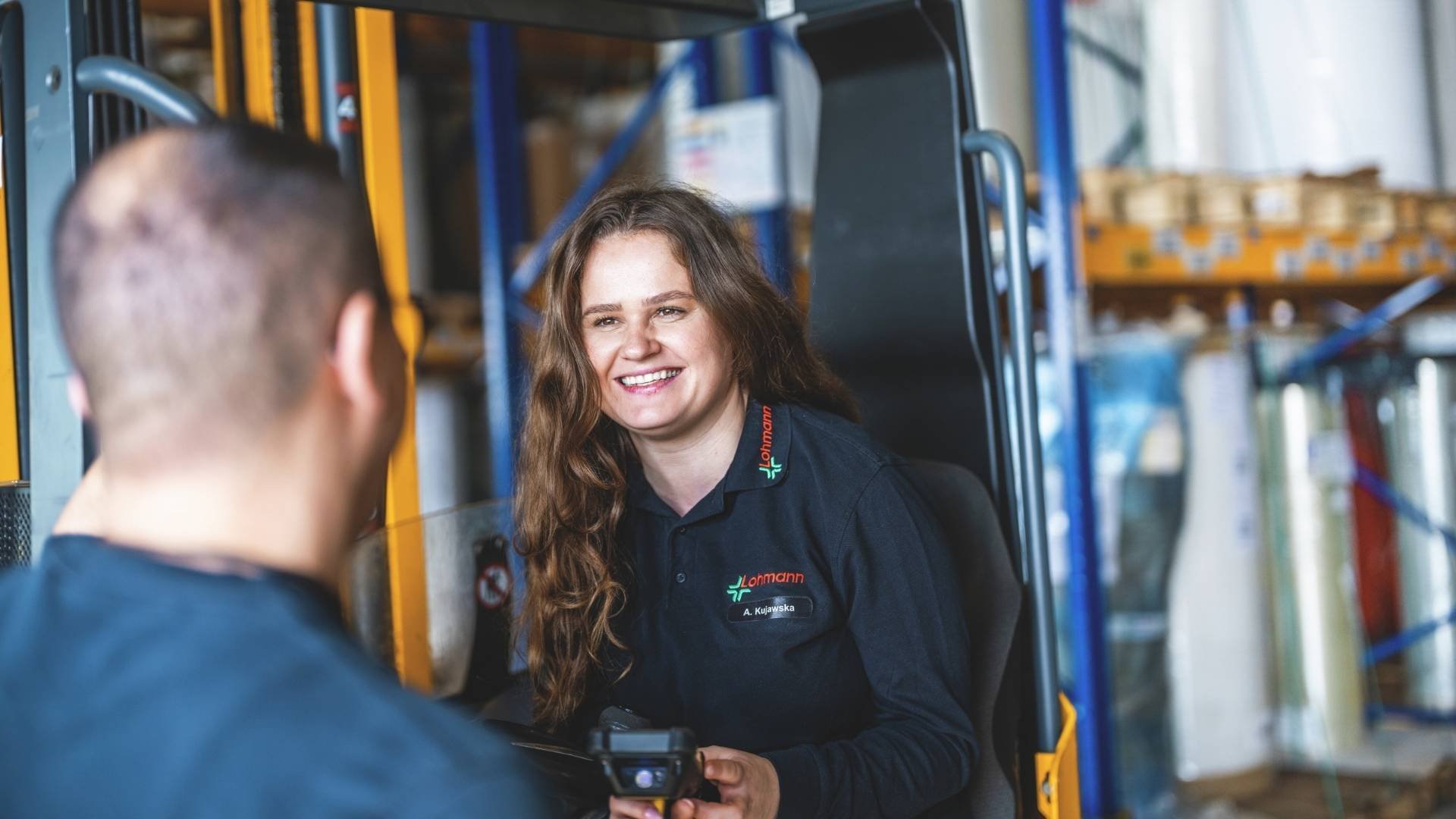 Warehouse-Logistics-Trainee-smiling-working