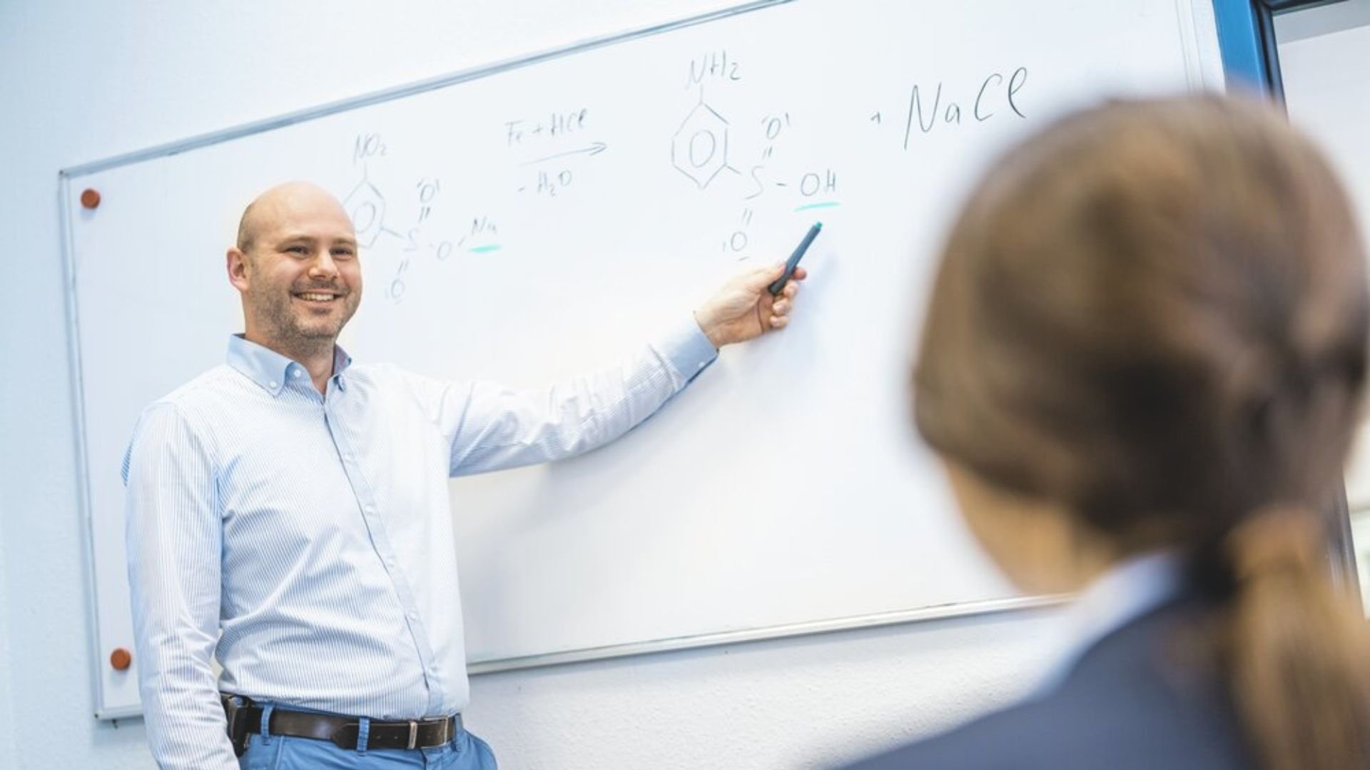 Male-colleague-explaining-board-discussion