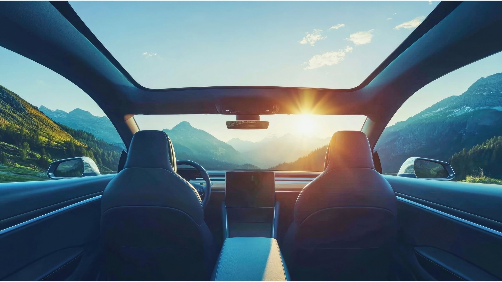 Automotive-glazing-high-end-car-interior-with-panoramic-sunroof-and-mountain-views-during-sunset