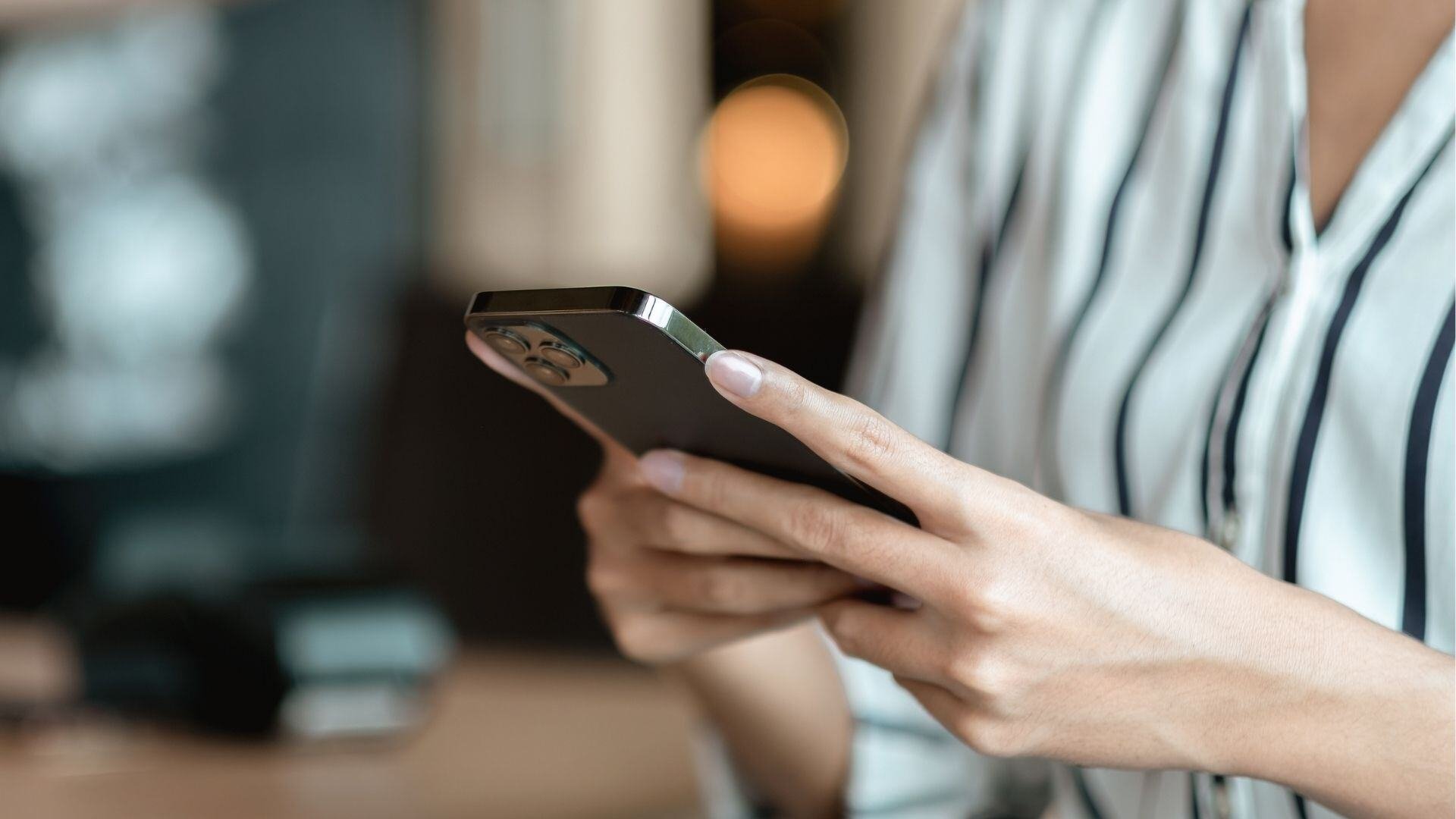 Electronics-close-up-of-woman-hands-using-smartphone