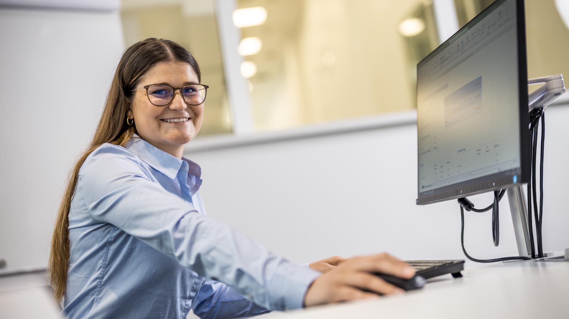 Trainee-industrial-clerk-at-computer