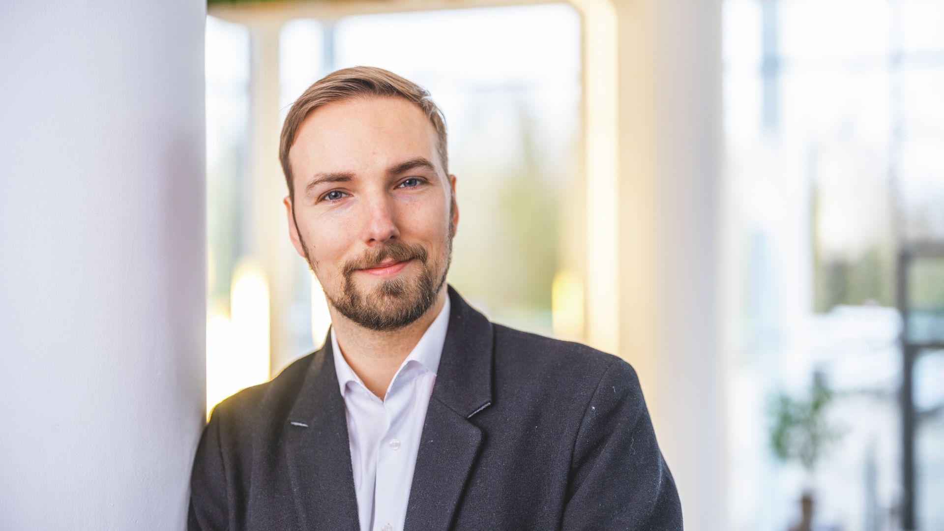 Oliver-Male-headshot-smiling-office attire